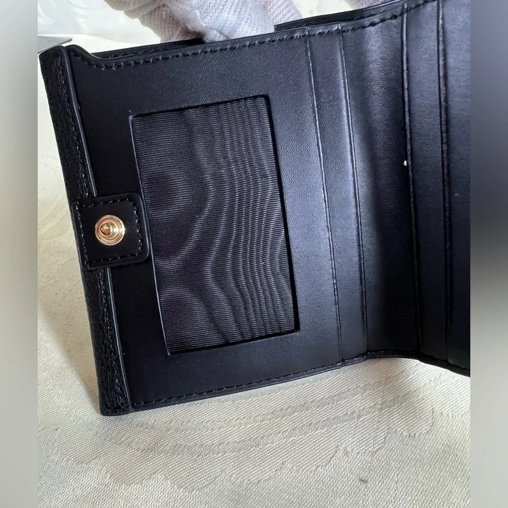 1017: Furla Black Pebbled Leather Compact Bifold Wallet